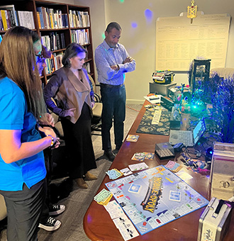 people looking over clues for the voodoo escape room