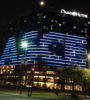 Windows of the Omni Hotel in Dallas lit in an arrangement to create the ASCE logo