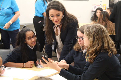 Dream Big featured civil engineer Menzer Pehlivan works with girls from St. Theresa School - from left, Isabelle Mascarenhas, Emily Frost, and Breda Brosey.