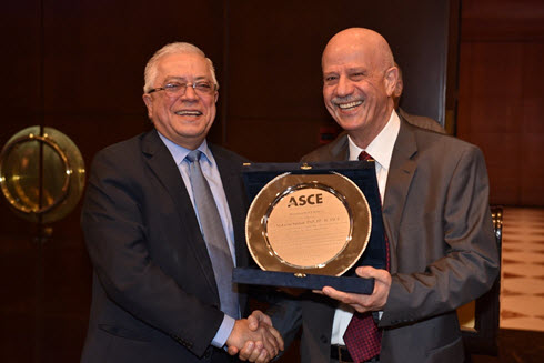 Federation of Lebanese Engineers President Khaled Chehab presents the Distinguished Engineer Award to Lebanon Section President Makram Tewfic Suidan. Photo courtesy Lebanon Section